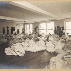Women factory workers hand sewing canvas at Waring & Gillow’s White City factory, 1914-1918. | City of Westminster Archive Centre